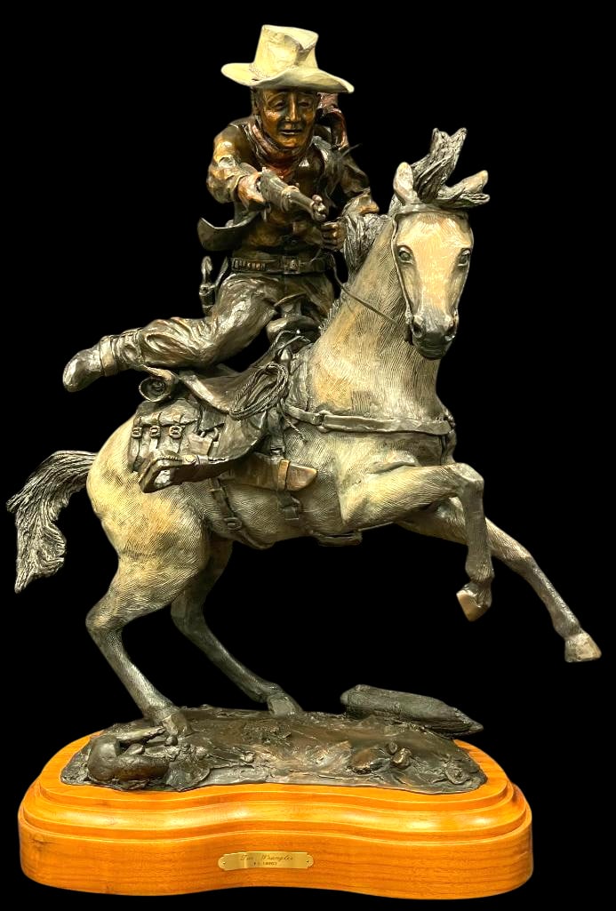 "The Wrangler" A John Wayne Bronze By R.G. Finney: Presented here for your consideration is a bronze sculpture titled "The Wrangler" by R.G. Finney. This fine bronze portrays John Wayne on horseback in full motion, rifle drawn, capturing detai