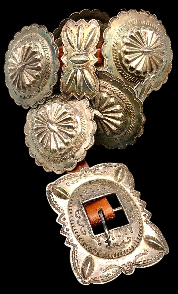 Vintage Sterling Silver Stamped Concho Belt: Offered here for your consideration is a vintage sterling silver stamped concho belt. The belt features seven oval conchos, six butterfly conchos and a rectangular buckle. Each is highlighted with han