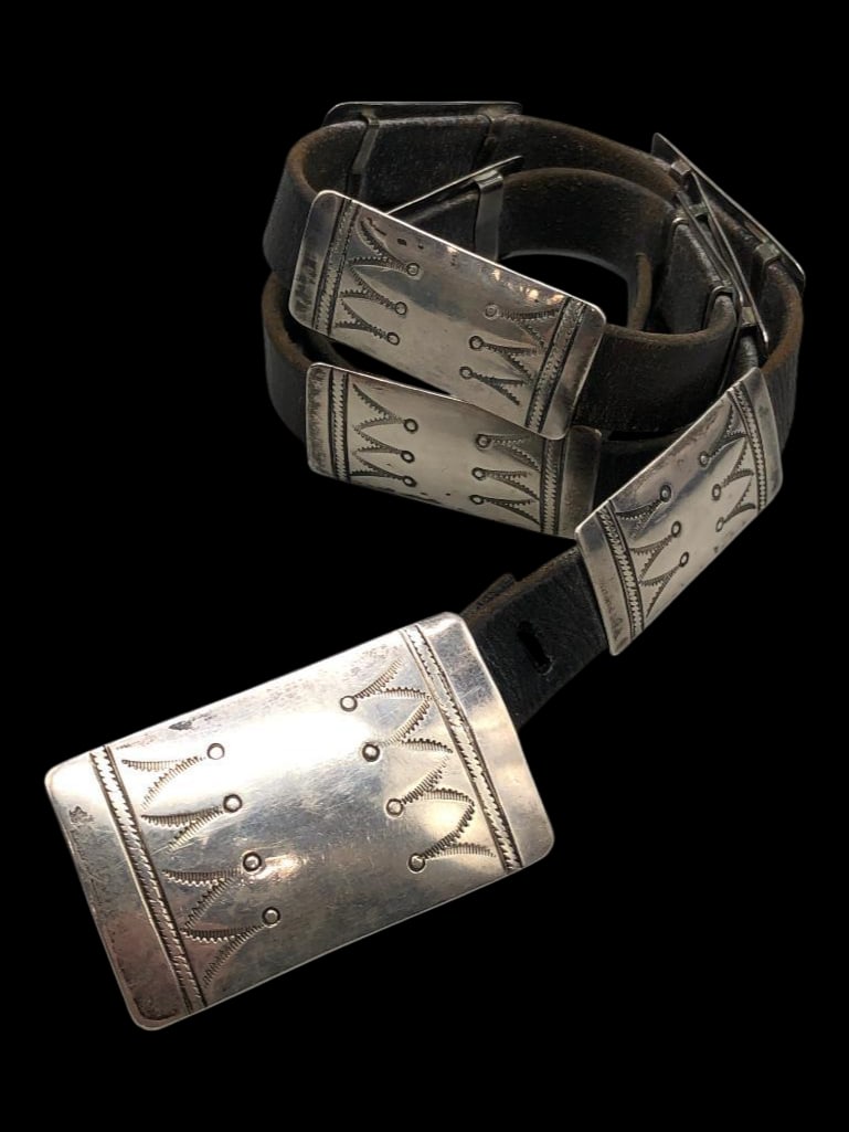 Circa 1930s - 1940s Sterling Silver Concho Belt: Offered here for your consideration is a circa 1930s - 1940s sterling silver concho belt. The belt has rectangular conchos and one larger rectangular buckle with hand stamped designs. The conchos are 