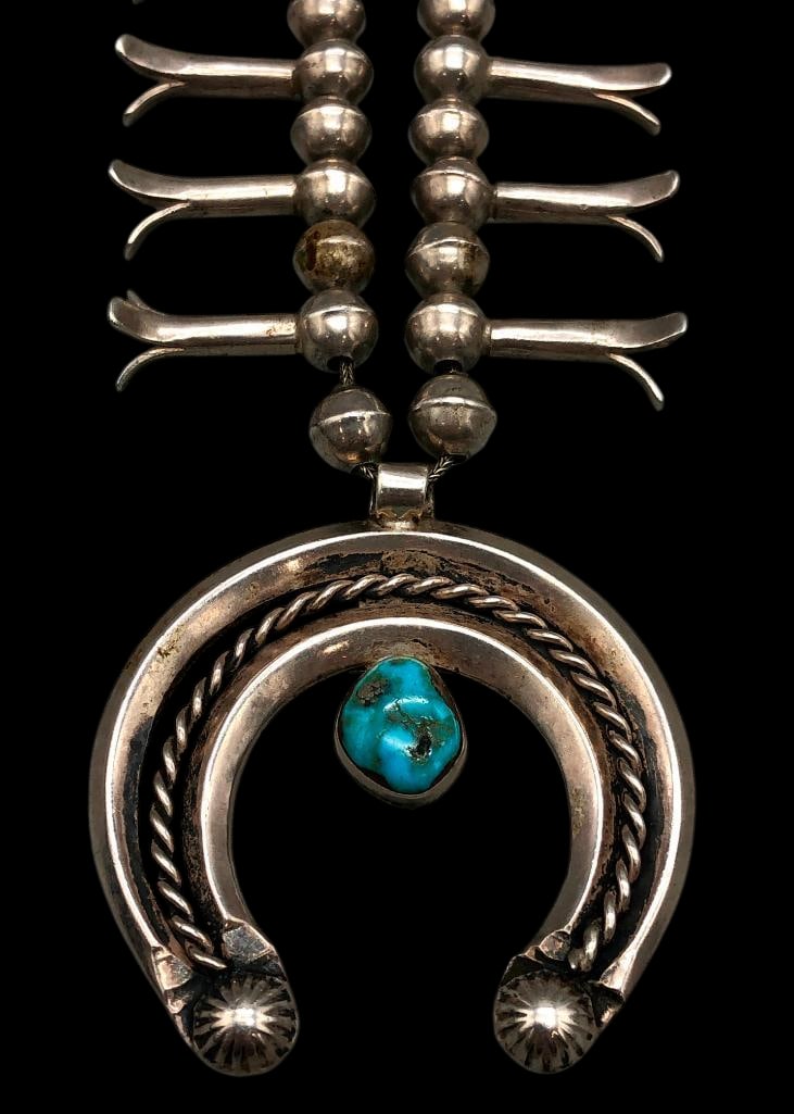 Vintage Handmade Bead Sterling Silver Squash Blossom Necklace: Offered here for your consideration is a vintage handmade bead sterling silver squash blossom necklace. The necklace features handmade beads with a naja highlighted with a turquoise cabochon set in a 