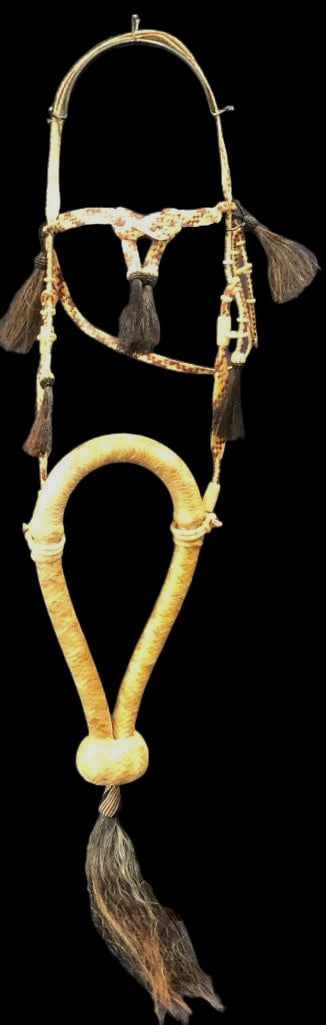 Handmade Rawhide And Horsehair Bosal By Norman Ismay: Offered here for your consideration is a handmade rawhide and horsehair Bosal by Norman Ismay. The Bosal shows rawhide body with nose button and long horsehair tassel / get down. Also included are mat