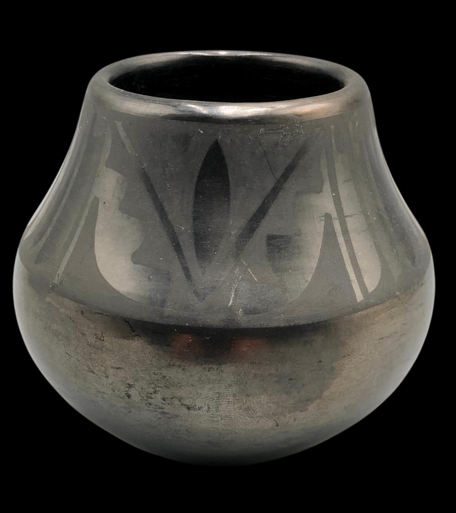 Vintage Maria Martinez & Santana Pottery Bowl: Presented here for your consideration is a classic black-on-black pottery bowl by Maria Martinez and Santana of San Ildefonso Pueblo. The vessel shows polished body with matte painted designs around t