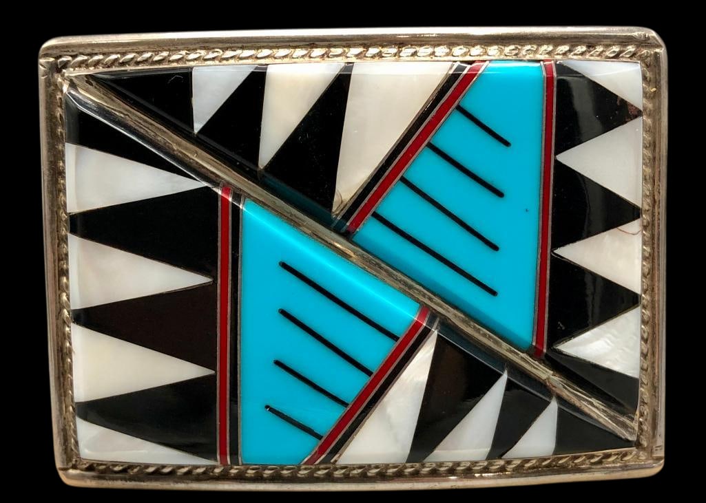 Multi Stone Inlay And Sterling Silver Buckle By E. Long: Offered here for your consideration is a multi stone inlay and sterling silver buckle by E. Long. This buckle features turquoise, coral, mother of pearl and onyx set in a geometric pattern framed by t