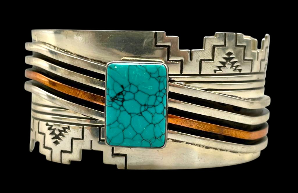 Sterling Silver And Turquoise Bracelet by R Monte: Offered here for your consideration is a sterling silver and turquoise bracelet by R. Monte. This bracelet features a rectangular turquoise cabochon with great webbing, set in a smooth silver bezel. I