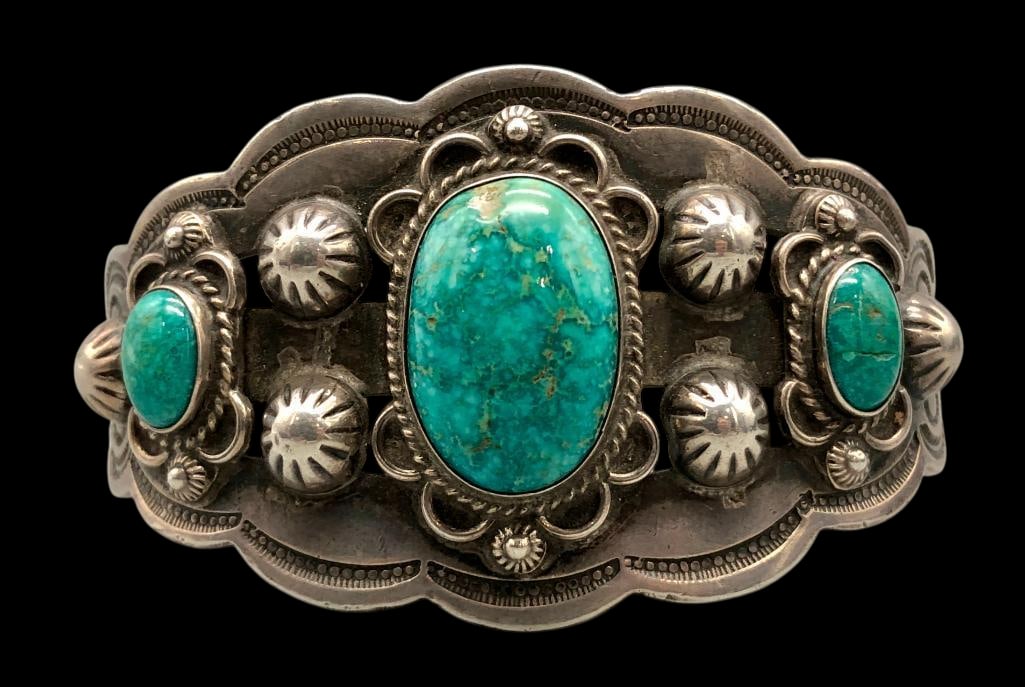 Vintage Three Stone Turquoise And Sterling Silver Bracelet: Offered here for your consideration is a vintage three stone turquoise and sterling silver bracelet. The bracelet features three turquoise cabochons set in smooth silver bezels and accented with silve