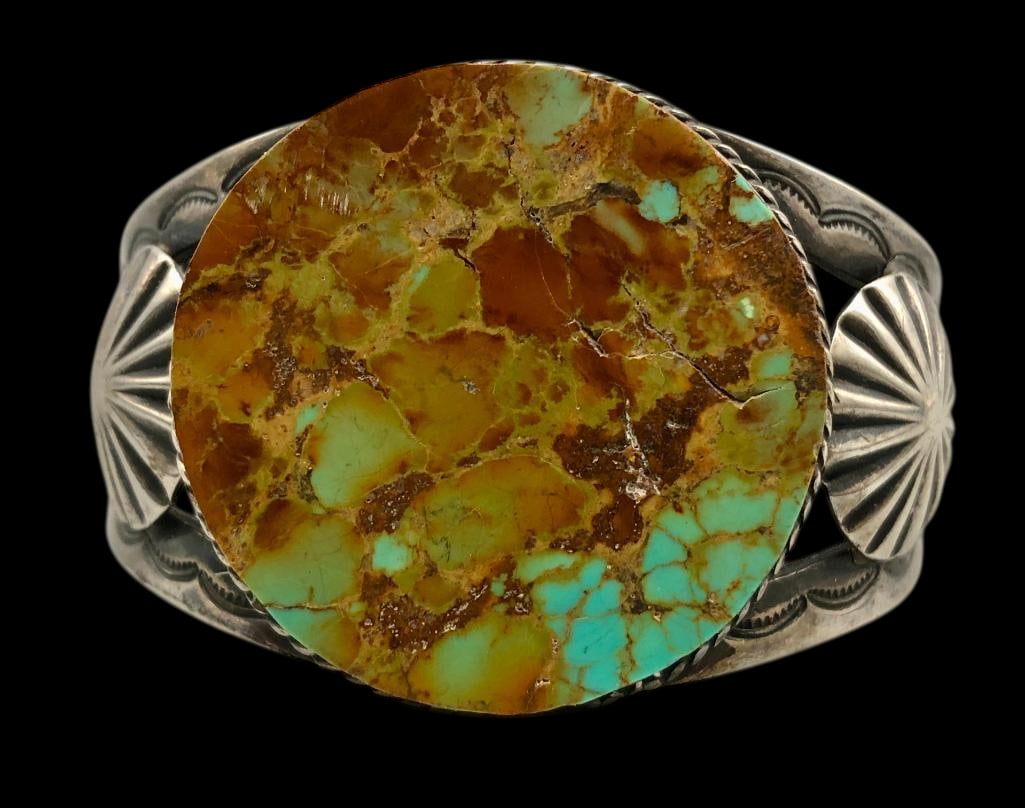 Vintage Turquoise and Sterling Silver Bracelet: Offered here for your consideration is a vintage turquoise and sterling silver bracelet. This bracelet features a large turquoise cabochon set in a smooth silver bezel accented with twisted wire and s