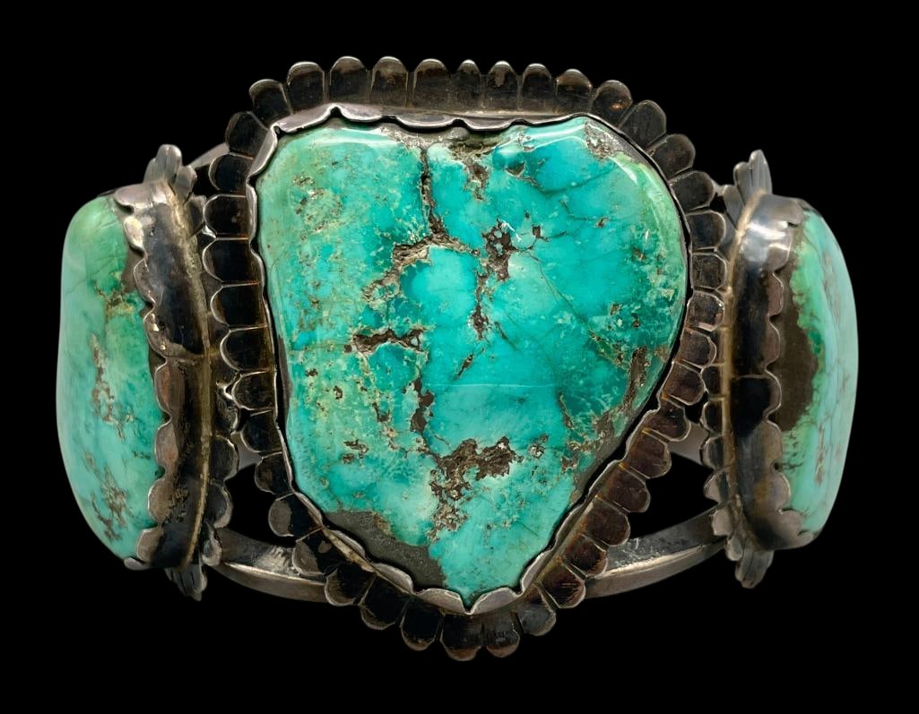 Massive Vintage Sterling Silver And Turquoise Bracelet: For your bidding enjoyment we present a massive vintage sterling silver and turquoise bracelet. This bracelet features three turquoise cabochons set in a scalloped silver bezels on a darkened backgrou