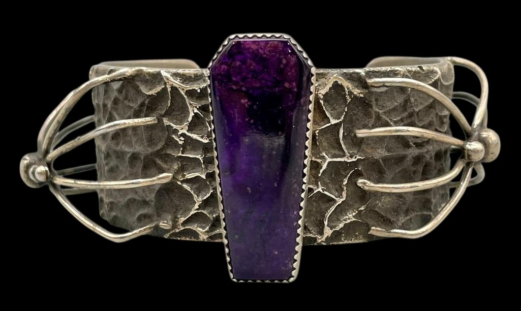 Spider Theme Sterling Silver And Sugilite Bracelet: Offered here for your consideration is a spider theme sterling silver and sugilite bracelet. The bracelet features a single sugilite cabochon set in a sawtooth silver bezel. The stone is set on a cuff