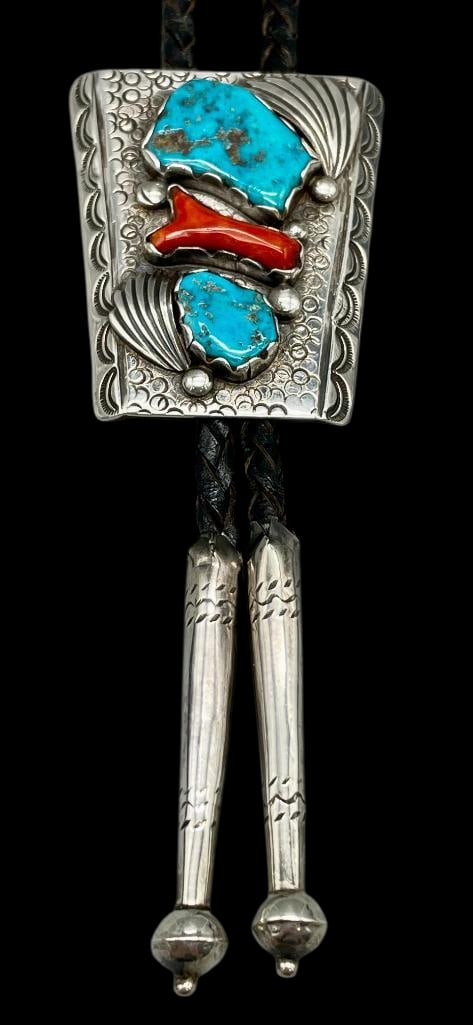 Vintage Sterling Silver, Turquoise And Coral Bolo: Offered here for your consideration is a vintage sterling silver, turquoise and coral bolo tie. The stones are set in scalloped silver bezels accented with silver dots, feather motifs and hand stamped