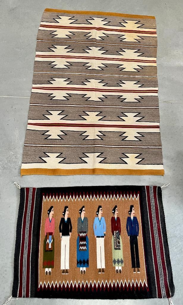Group Of Two Navajo Rugs: Available here for your consideration is a group of two Navajo Rugs. The first one is a Burnham design Navajo rug which depicts a group of Navajo weavers and men in traditional clothing, with the wome