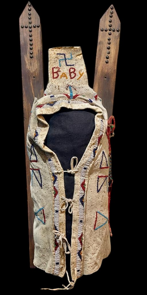 Antique Sioux Cradle Board With Beadwork: Offered here for your consideration is an antique Sioux cradle board with beadwork. This cradle board features classic geometric beadwork in multicolored seed beads on softened hide, with wood backboa