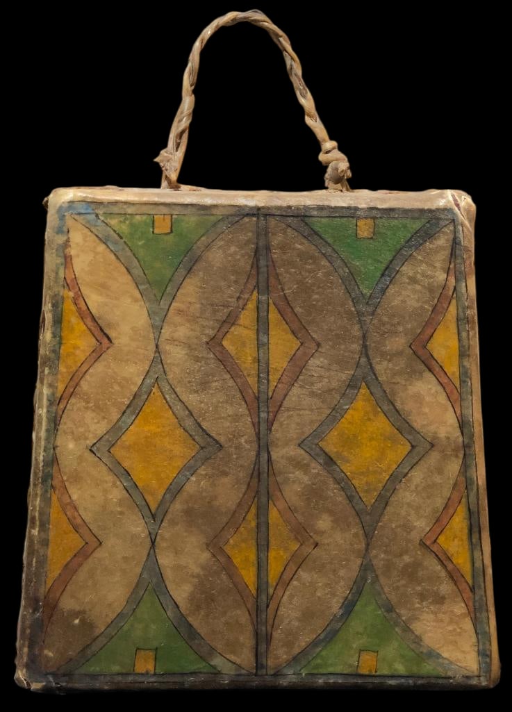 Unusual Square Shaped Rawhide Covered Drum: Offered here for your consideration is an unusual square shaped rawhide drum which features painted geometric designs and rawhide lacing on the sides with a carrying handle. Add this unique drum to yo