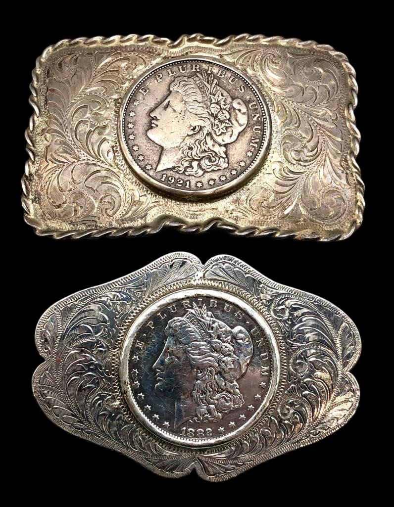 Two Sterling Silver Belt Buckles Featuring Morgan Silver Dollars: Offered here for your consideration is two sterling silver belt buckles featuring Morgan silver dollars. Both pieces feature Morgan silver dollars minted in 1882 and 1921 and are accented with hand st