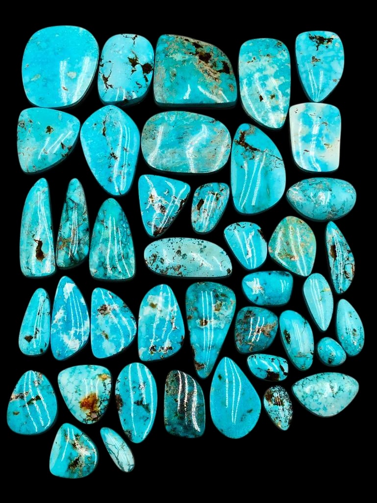Approximately 1000 Carats Kingman Turquoise Cabochons: Offered here for your consideration are approximately 1000 carats of Kingman turquoise cabochons. Kingman turquoise originates from the Mineral Park Mining District near Kingman, Arizona. The mine is