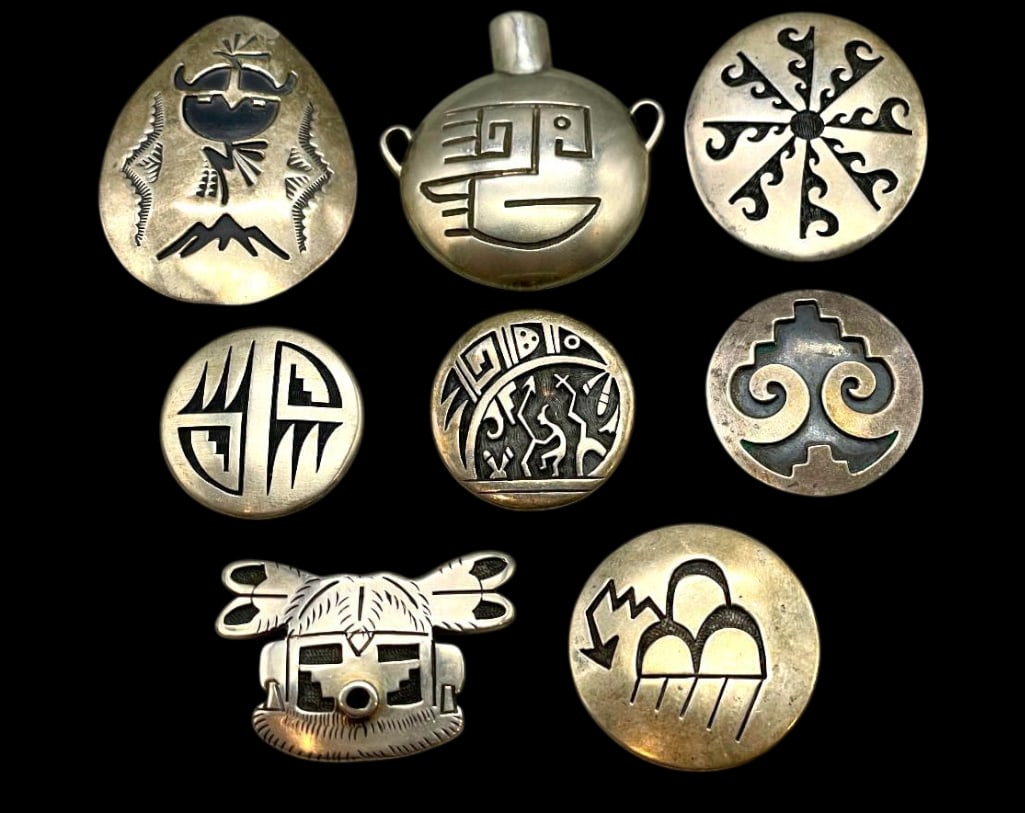Eight Sterling Silver Hopi And Navajo Pins/Pendants: Offered here for your consideration are eight sterling silver Hopi and Navajo pins/pendants. These items showcase overlay style designs made by several Hopi artists and one Navajo artist. The designs