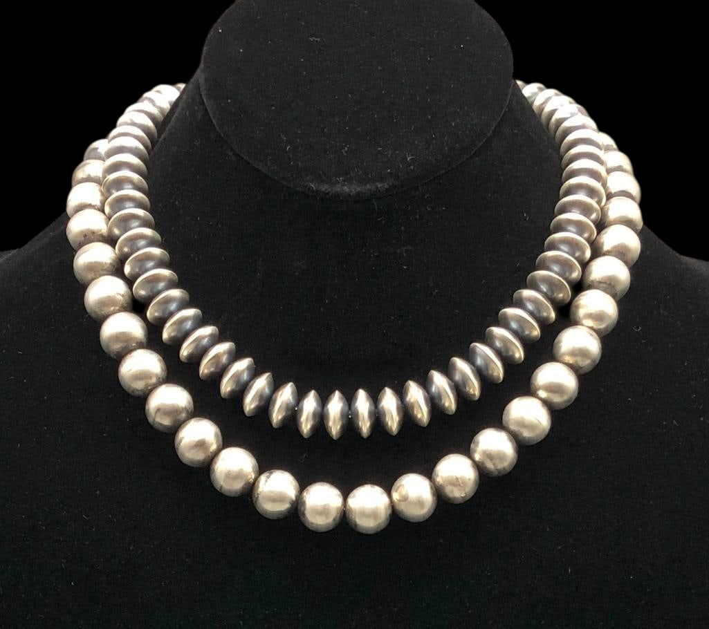 Two Contemporary Sterling Silver Beaded Necklaces: Offered here for your consideration is a pair of contemporary sterling silver beaded necklaces. These pieces feature round or disc shaped sterling silver beads strung on a chain with silver findings a