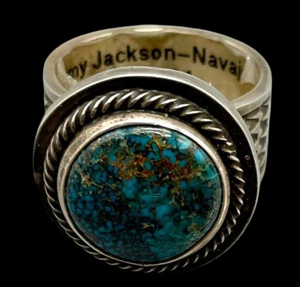 Apache Blue Turquoise Ring By The Late Tommy Jackson: Offered here for your consideration is an Apache blue turquoise ring by the late Tommy Jackson. This piece features an Apache Blue turquoise cabochon set in a smooth silver bezel accented with twisted