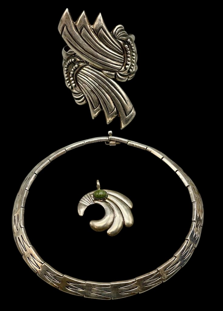 Group Of Mexico Silver Necklace, Bracelet And Pendant: For your bidding enjoyment we present a group consisting of a Mexico silver necklace, bracelet and pendant. The necklace is composed of multiple silver links, each featuring the same shaped design. Th