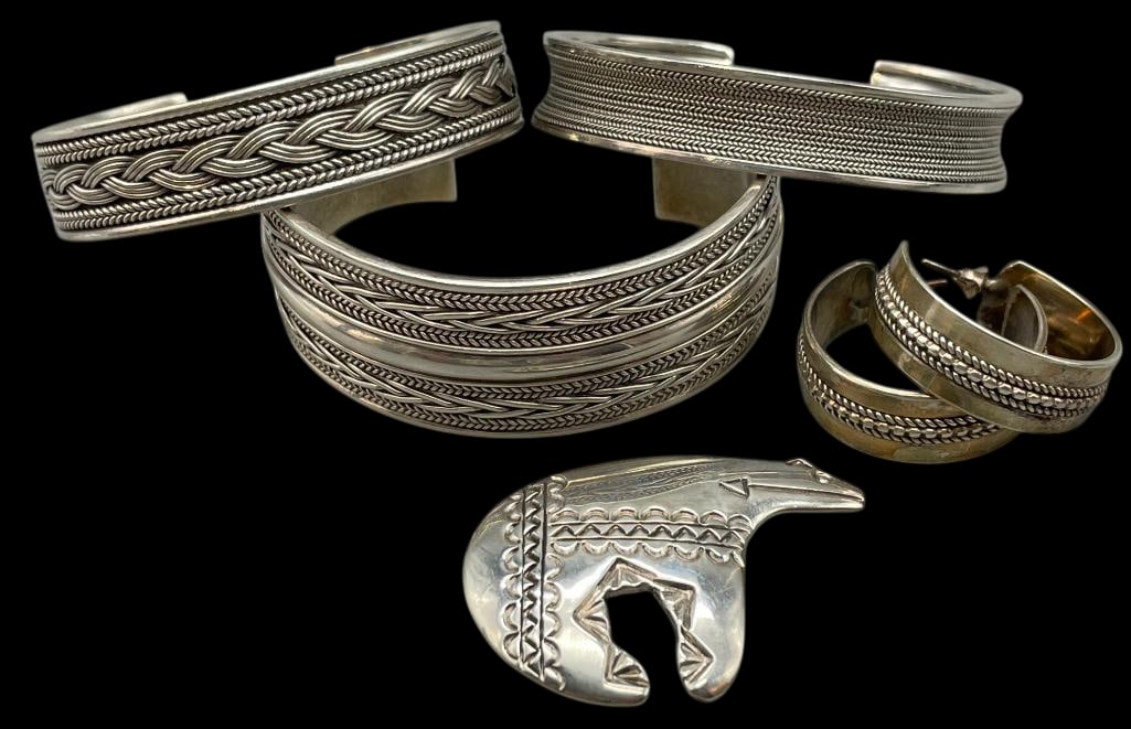 Three Sterling Silver Bracelets, Bear Pin/Pendant And Pair Of Earrings: Presented here for your consideration are three sterling silver bracelets, bear pin/pendant and a pair of earrings. Each piece is highlighted with hand stamped or twisted wire designs. The earrings