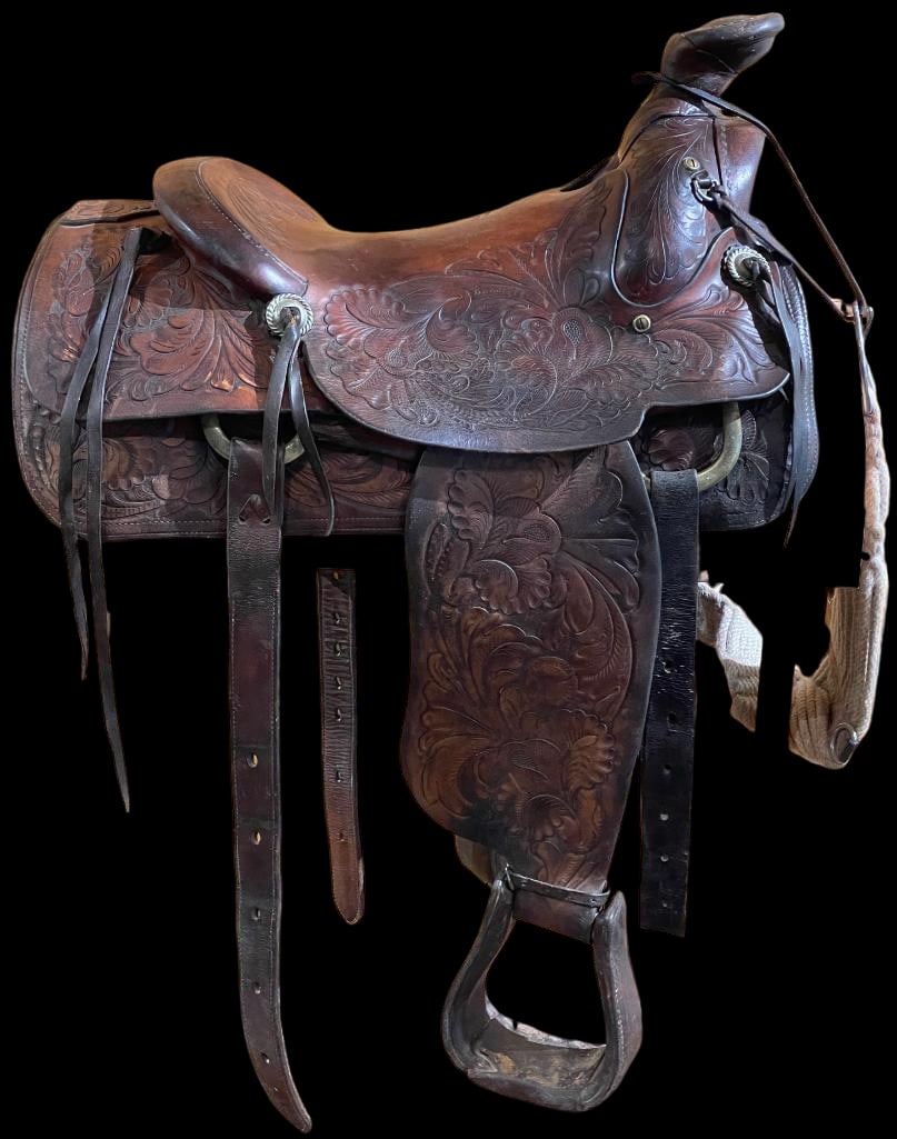 Vintage Porter Saddle: Offered here for your consideration is a vintage Porter, "Genuine Trophy" saddle with silver concho horn cap. This saddle features tooled designs throughout and is in good shape for its age.