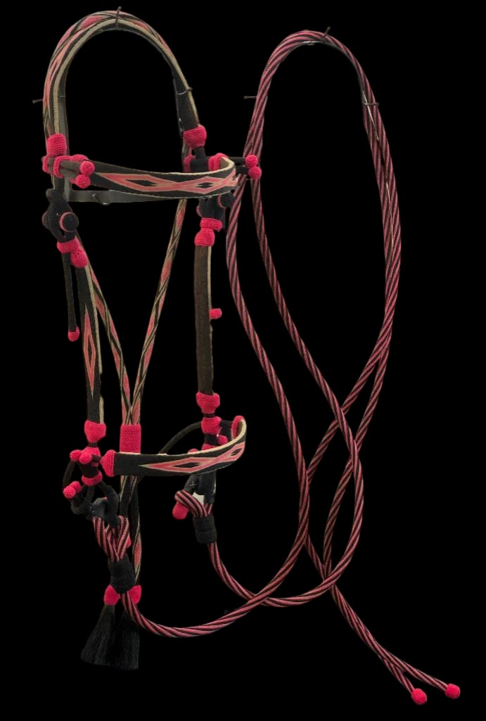Contemporary Deer Lodge Hitched Horsehair Bridle: Offered here for your consideration is a Deer Lodge hitched horsehair bridle. This bridle features detailed designs in white, black and hot pink dyed horsehair. This set includes split reigns. Deer