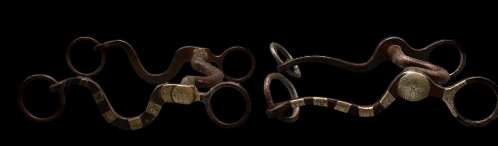 Two Antique Bits - One Crockett And One Kelly Brothers: Offered here for your consideration are two antique bits. One is marked Crockett and the other is marked Kelly Brothers. Both feature iron construction with decorative silver overlays on the cheeks.