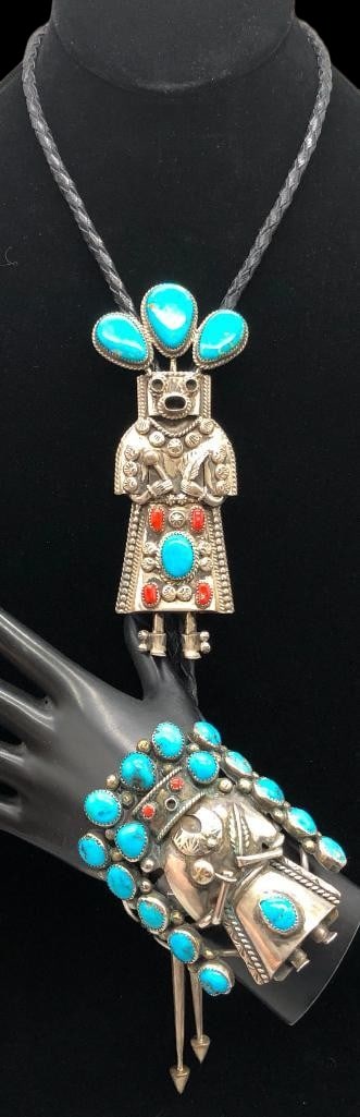 Sterling Silver, Turquoise And Coral Kachina Theme Bolo Tie With Bracelet: Offered here for your consideration is a sterling silver, turquoise and coral Kachina theme bolo tie with bracelet. Both pieces feature Kachina designs highlighted with turquoise and coral cabochons s