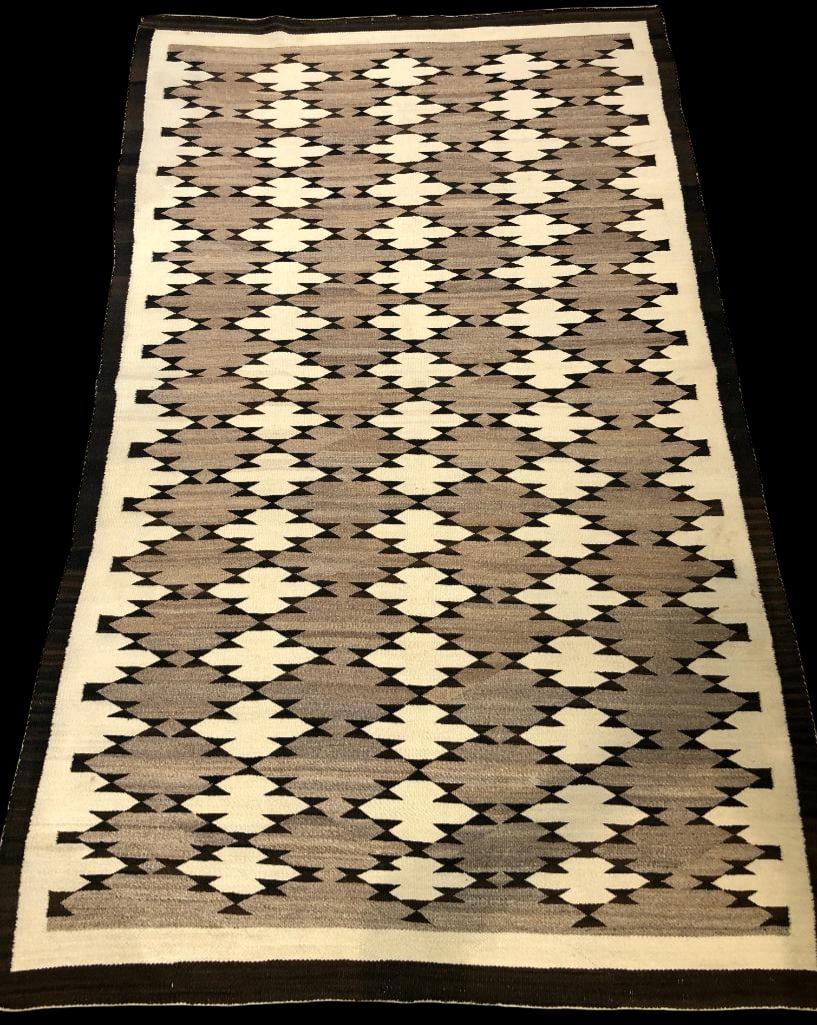 Circa 1950s Butterfly Pattern Navajo Rug: Available here for your consideration is a circa 1950s butterfly pattern Navajo rug. This textile was woven from hand carded, hand spun wool. It features rows of white clover like motifs framed by sma
