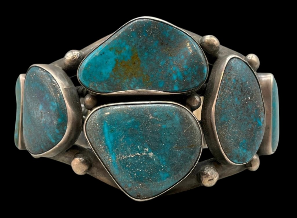 Six Stone Turquoise And Sterling Silver Bracelet: Offered here for your consideration is a six stone turquoise and sterling silver bracelet. This piece features six turquoise cabochons with a great brown matrix set in smooth silver bezels. The stones