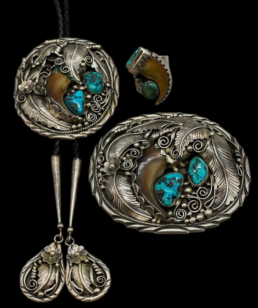 Sterling Silver, Turquoise And Claw Bolo, Buckle And Ring By Daniel Martinez: Offered in this lot are a sterling silver, turquoise and claw bolo tie, buckle and ring by Daniel Martinez. The slide and buckle each feature the same design highlighted with lovely turquoise cabochon