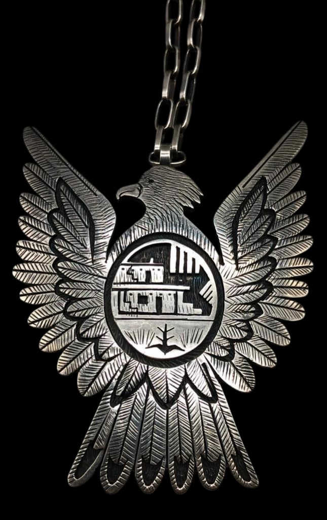 Victor Coochwytenwa Silver Overlay Eagle Pendant Necklace: Offered here for your consideration is a Victor Coochwytewa silver overlay eagle pendant necklace. This pendant showcases a bold eagle motif with detailed feathers. At its center, an overlay depicts a