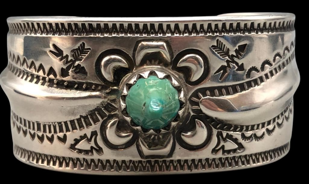 Lyndon Tsosie Ingot Sterling Silver And Conical Turquoise Bracelet: For your bidding pleasure is a Lyndon Tsosie ingot sterling silver conical turquoise cuff bracelet. This bracelet features a conical shaped turquoise stone set in a sawtooth silver bezel. The stone is