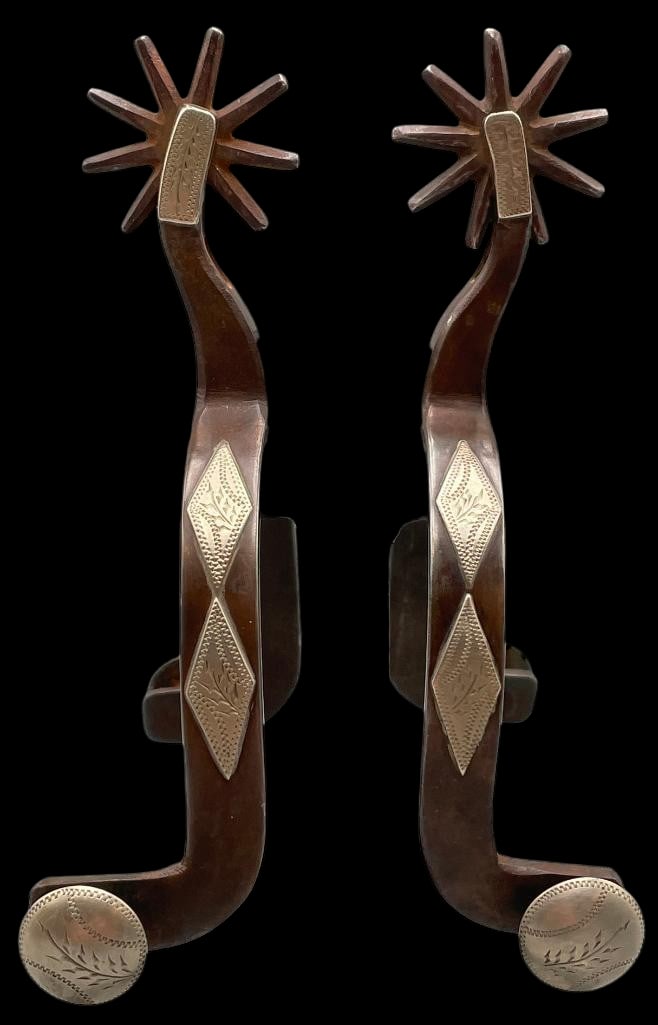 Antique Pair KB & P Cowgirl Spurs Circa 1910-1919: Offered here for your consideration is a pair of antique KB & P cowgirl spurs circa 1910-1919. These Texas style spurs feature diamond shaped overlay designs along the heel bands accented with eng