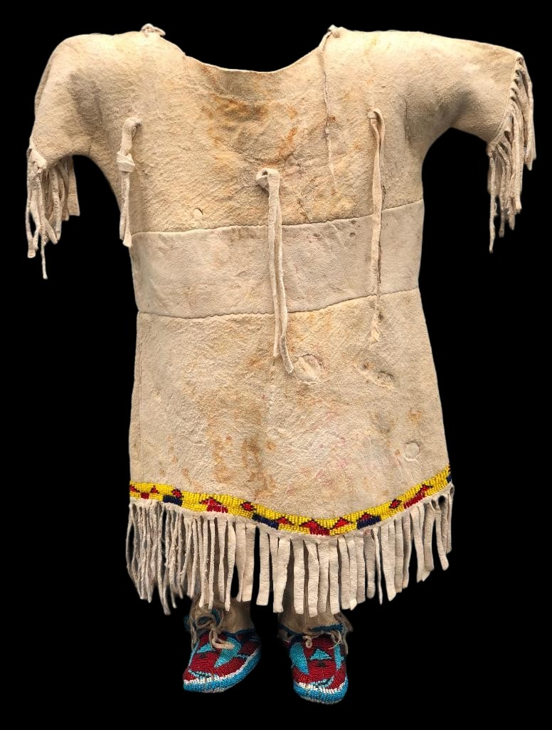 Northern Plains Toddler Dress With Beaded Moccasins Circa 1900: Available here for your consideration is a fine, Northern Plains toddler size dress with beaded moccasins from circa 1900. Both pieces feature bead work done in colors of red, yellow, blue and others