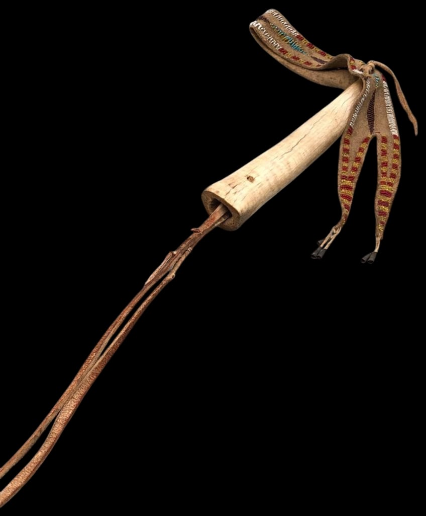 Late 1800s Sioux Elk Horn Quirt With Beadwork: Offered here for your consideration is late 1800s Sioux elk horn quirt with bead work. This quirt is highlighted with seed beads in colors of red, purple, white and others. The beads are sewn on brain