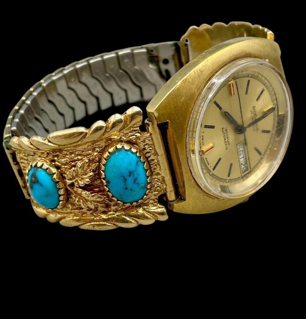 14K Gold And Turquoise Watch Tips: Offered here for your consideration is 14K gold (tested) and turquoise watch tips. This piece features four turquoise cabochons set in gold sawtooth bezels. Accenting the stones are leaf motifs set on