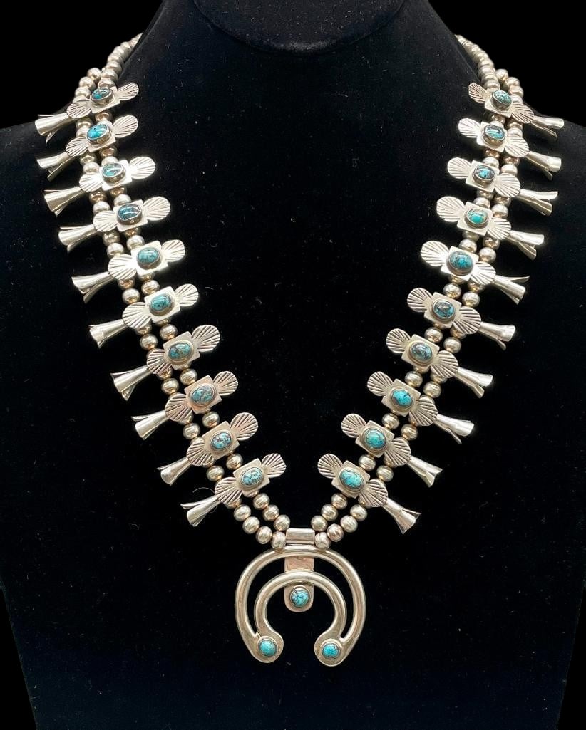 Circa 1960s - 1970s Box Bow Squash Blossom Necklace: For your bidding pleasure is a circa 1960s - 1970s box bow squash blossom necklace. This piece features a two wire naja highlighted with three round turquoise cabochons set in smooth silver bezels. Th