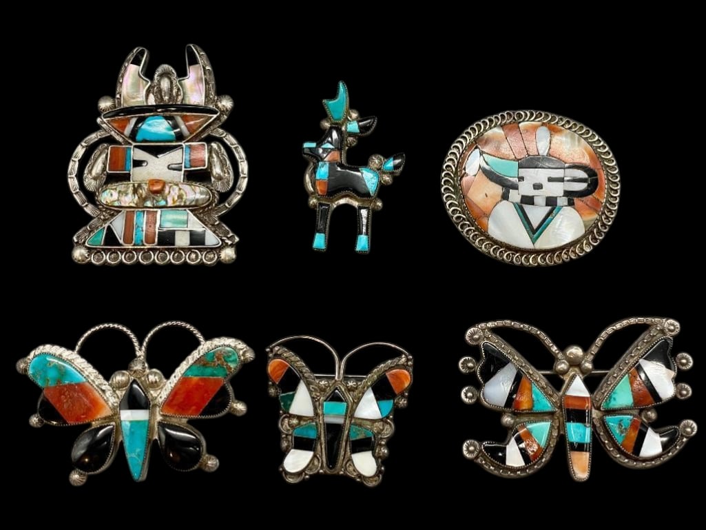 Six Zuni Sterling Silver And Inlay Pins: Offered here for your consideration are six Zuni sterling silver and inlay pins. This group features different Kachina, butterfly and antelope designs created with a multi stone inlay. The stones incl