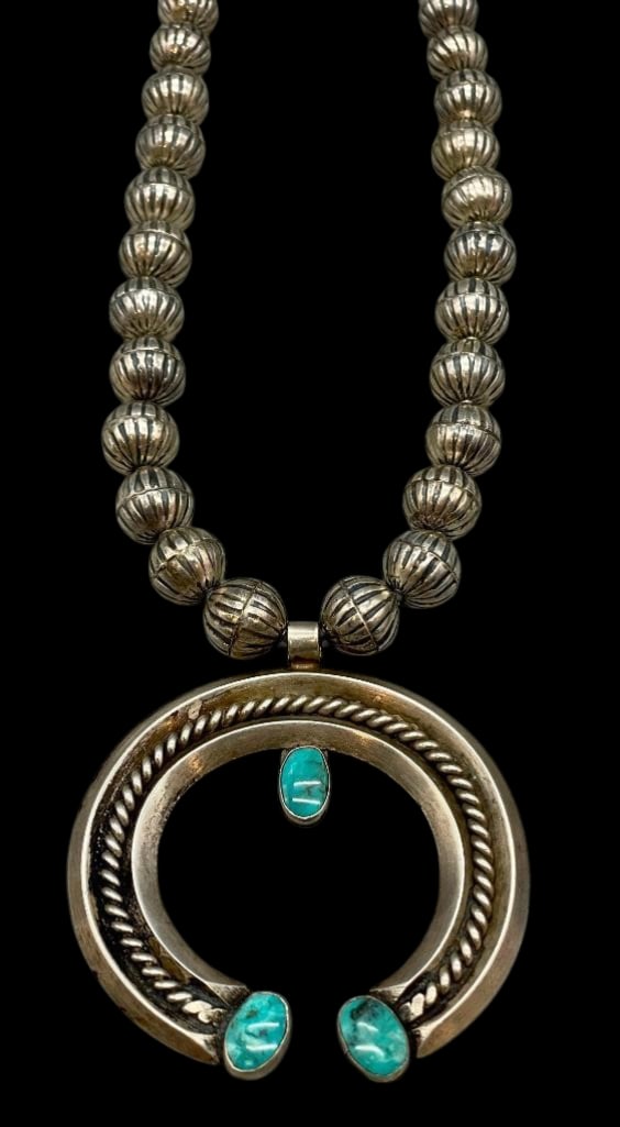 Sterling Silver Fluted Bead And Naja Necklace With Pueblo Wrap: Offered here for your consideration is a sterling silver fluted bead and naja necklace with pueblo wrap. The necklace features a two wire naja accented with a twisted wire and three turquoise cabochon
