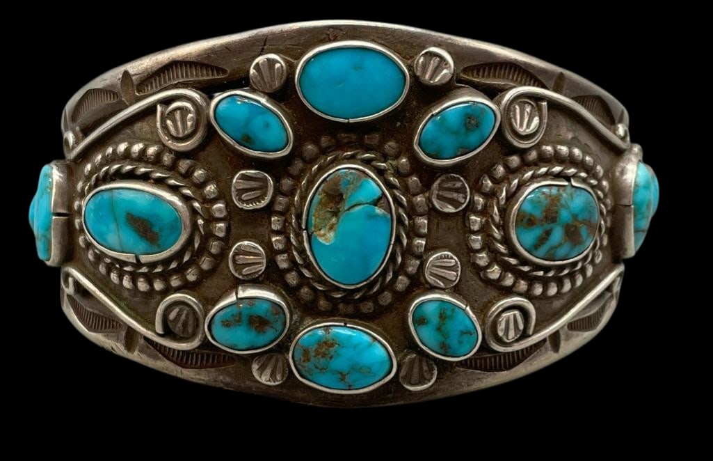 Great Older Sterling Silver And Turquoise Bracelet: Offered here for your consideration is an older sterling silver and turquoise bracelet. This bracelet features multiple turquoise cabochons set in smooth silver bezels. Accenting the stones are coiled