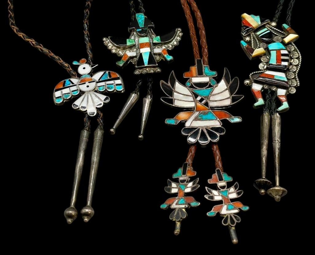 Four Zuni Figural Inlay Bolo Ties: Offered here for your consideration are four Zuni figural inlay bolo ties. Each slide features a multi stone inlay set in silver depicting Zuni figural designs. The stones include turquoise, coral, mo