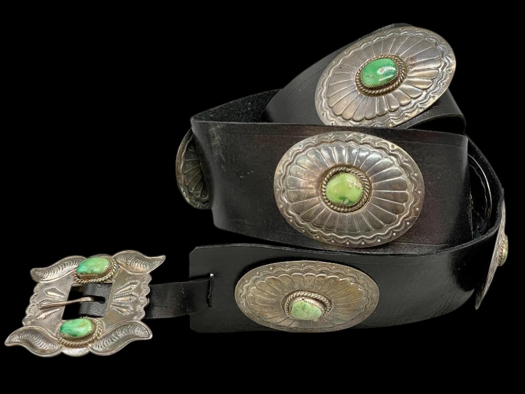Circa 1980s Sterling Silver And Green Turquoise Concho Belt: Offered here for your consideration is a circa 1980s sterling silver and green turquoise concho belt. This piece features nine oval conchos each highlighted with green turquoise cabochons set in sawto