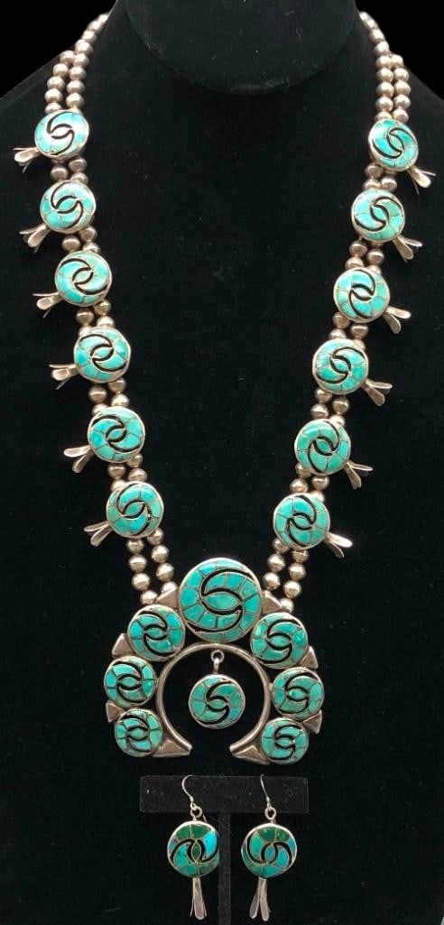 Circa 1960s Turquoise Inlay Four Petal Squash Blossom Necklace And Earrings: Offered here for your consideration is a circa 1960s turquoise inlay four petal squash blossom necklace and earrings attributed to Ellen Quandelacy. The naja is highlighted with seven channel inlay de