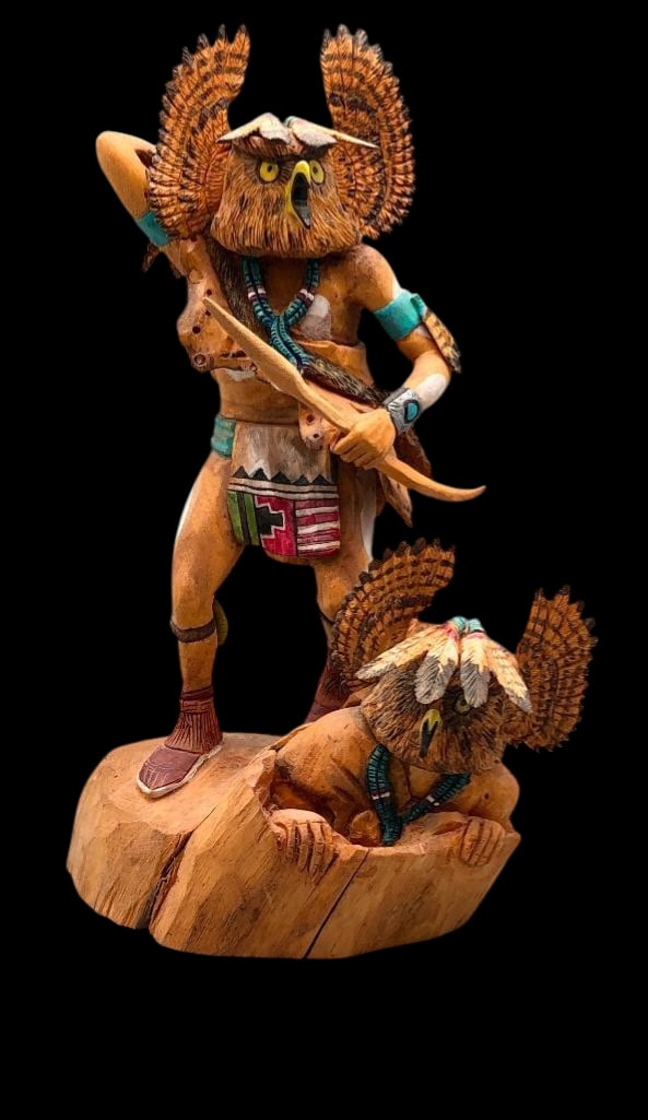 Double Horned Owl By Raymond M. Chee: Offered here for your consideration is a carving titled “Double Horned Owl” by Raymond M. Chee. The carving features two Owl Kachina dancers on a carved base. One is standing and appears to be