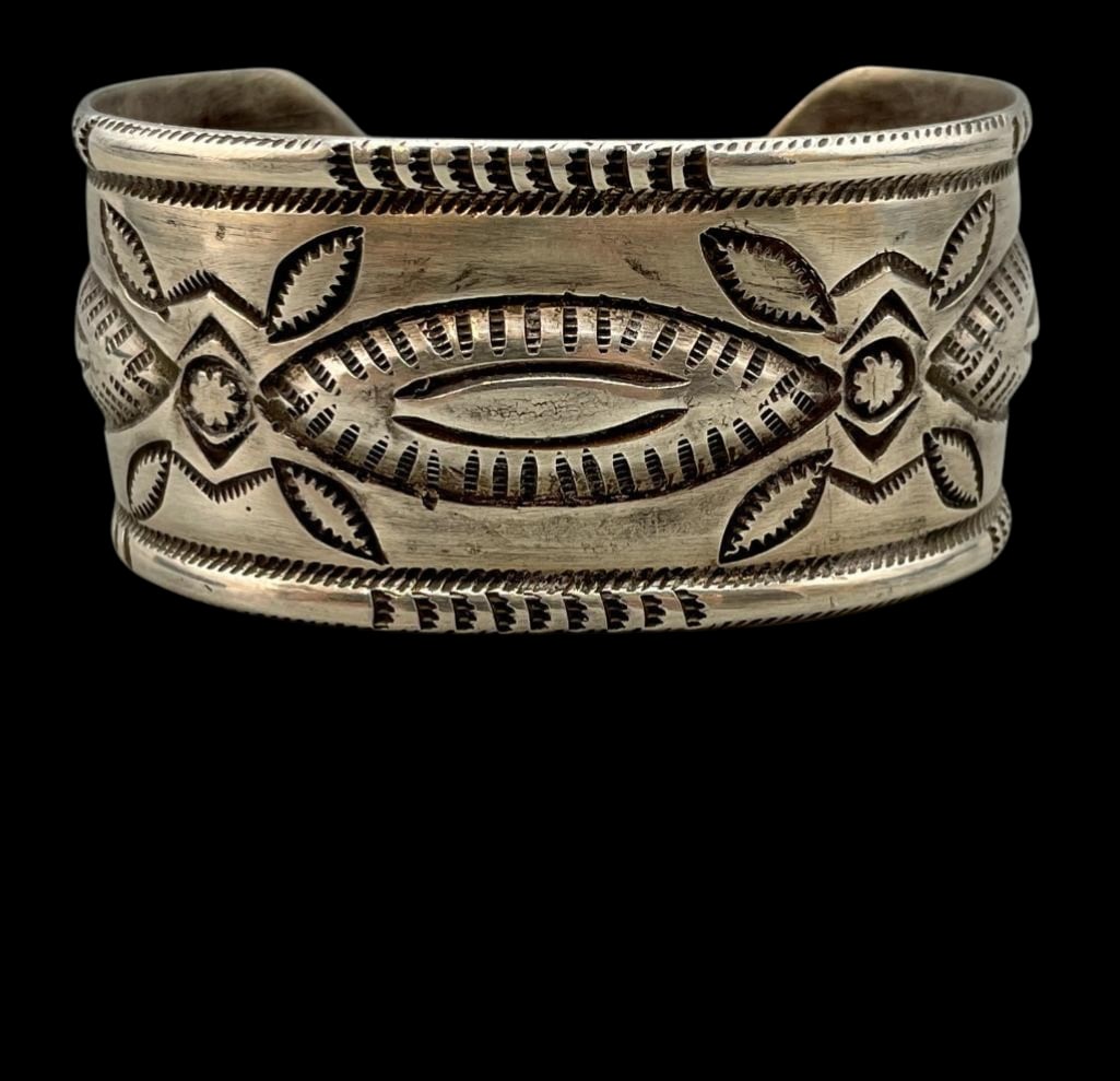 Ingot Silver, Repousse And Stamped Bracelet: Offered here for your consideration is an ingot silver, repoussé and stamped bracelet. This bracelet features a wide silver cuff accented with repoussé and hand stamped designs. This bracelet would