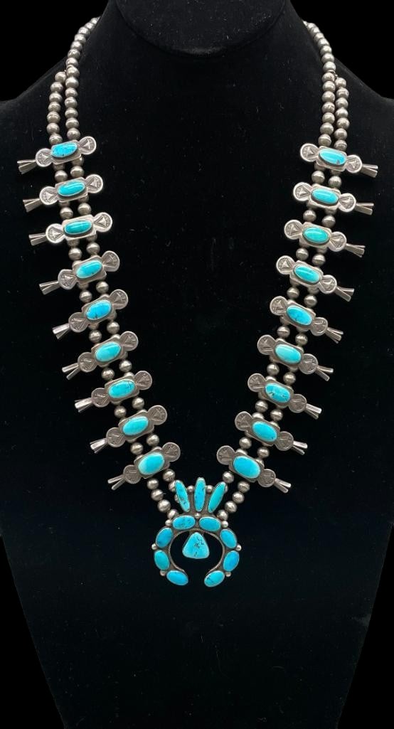 Circa 1940s-1950s Sterling And Great Turquoise Squash Blossom Necklace With Four Petals Handmade: Offered here for your consideration is a circa 1940s - 1950s sterling silver and great turquoise squash blossom necklace with four petal blossoms and handmade beads. This piece features a naja highlig