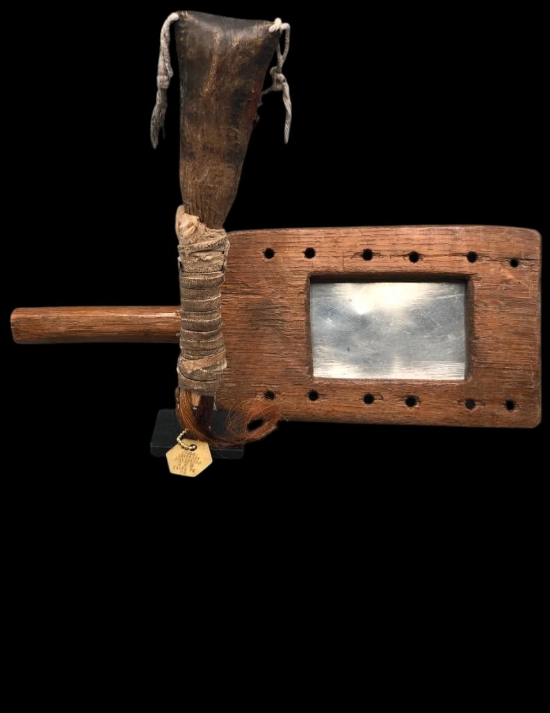 Navajo Buffalo Rattle with Stand And Antique Signaling Mirror: Offered here for your consideration is a rare Navajo buffalo rattle with a custom stand and an antique signaling mirror. The rattle is fashioned from buffalo rawhide and features a wooden handle wrapp