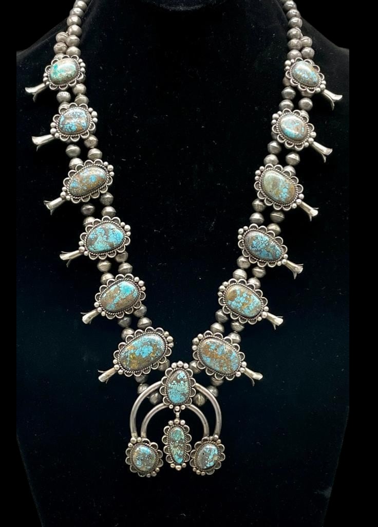 Vintage Squash Blossom Necklace With High Grade Webbed Turquoise And Handmade Beads: Offered here for your consideration is a vintage squash blossom necklace with high grade webbed turquoise and handmade beads. This necklace features a two wire naja highlighted with three turquoise ca