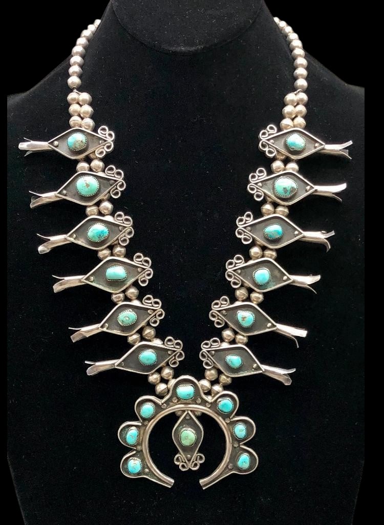 Vintage Sterling Silver And Turquoise Squash Blossom Necklace With Handmade Beads: Offered here for your consideration is a vintage sterling silver and turquoise squash blossom necklace with handmade beads. The naja features eight turquoise cabochons all set in sawtooth silver bezel