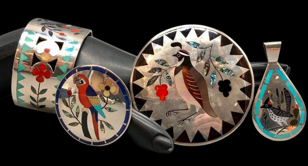 Group Of Vintage D & N Edaakie Jewelry: Offered here for your consideration is a group of vintage Dennis and Nancy Edaakie jewelry. This group features a bracelet, pendant and two pins/pendants each with multi-stone flush inlay in bird desi